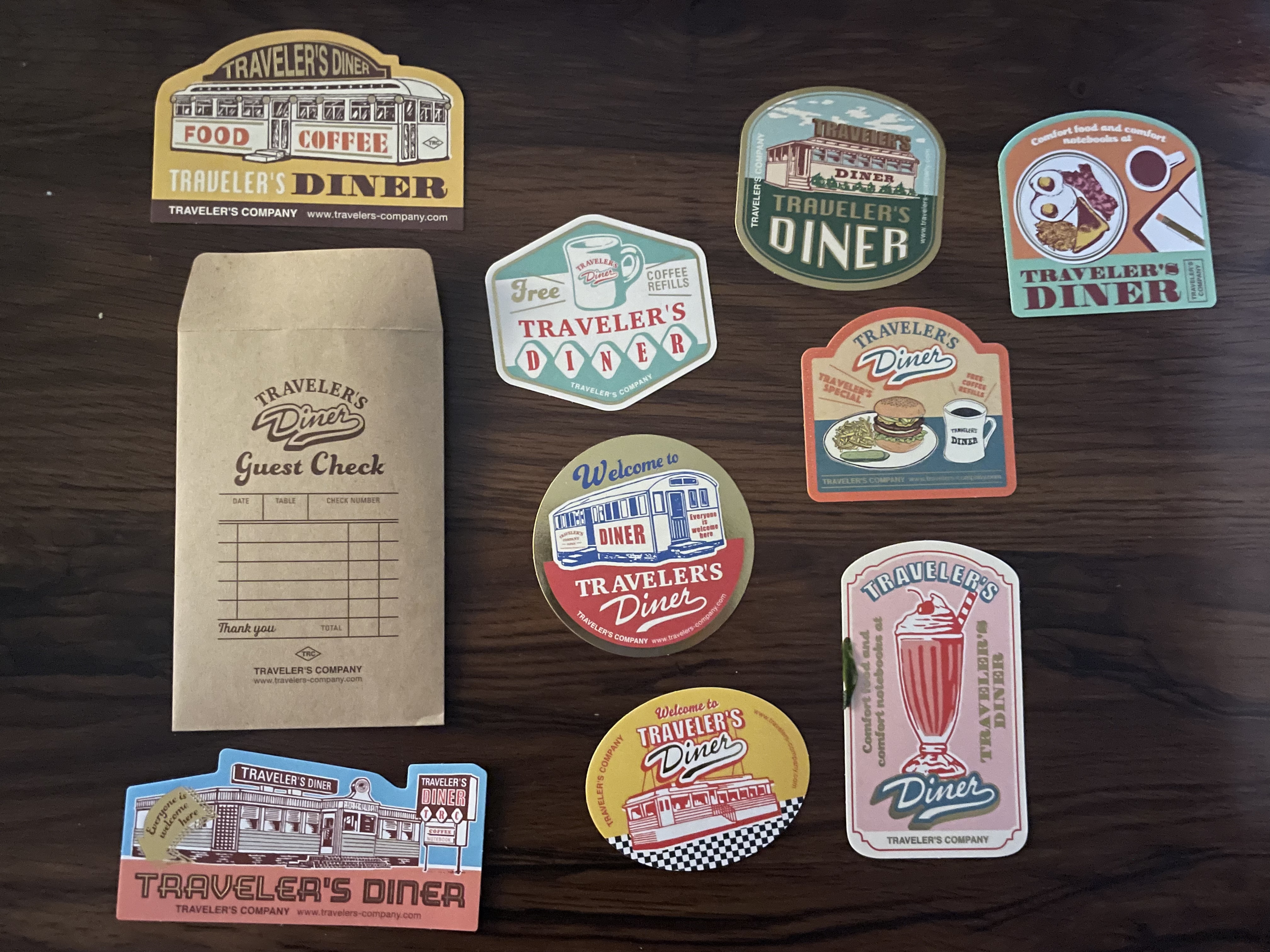 a kraft envelope with nine stickers of various retro diner aesthetics