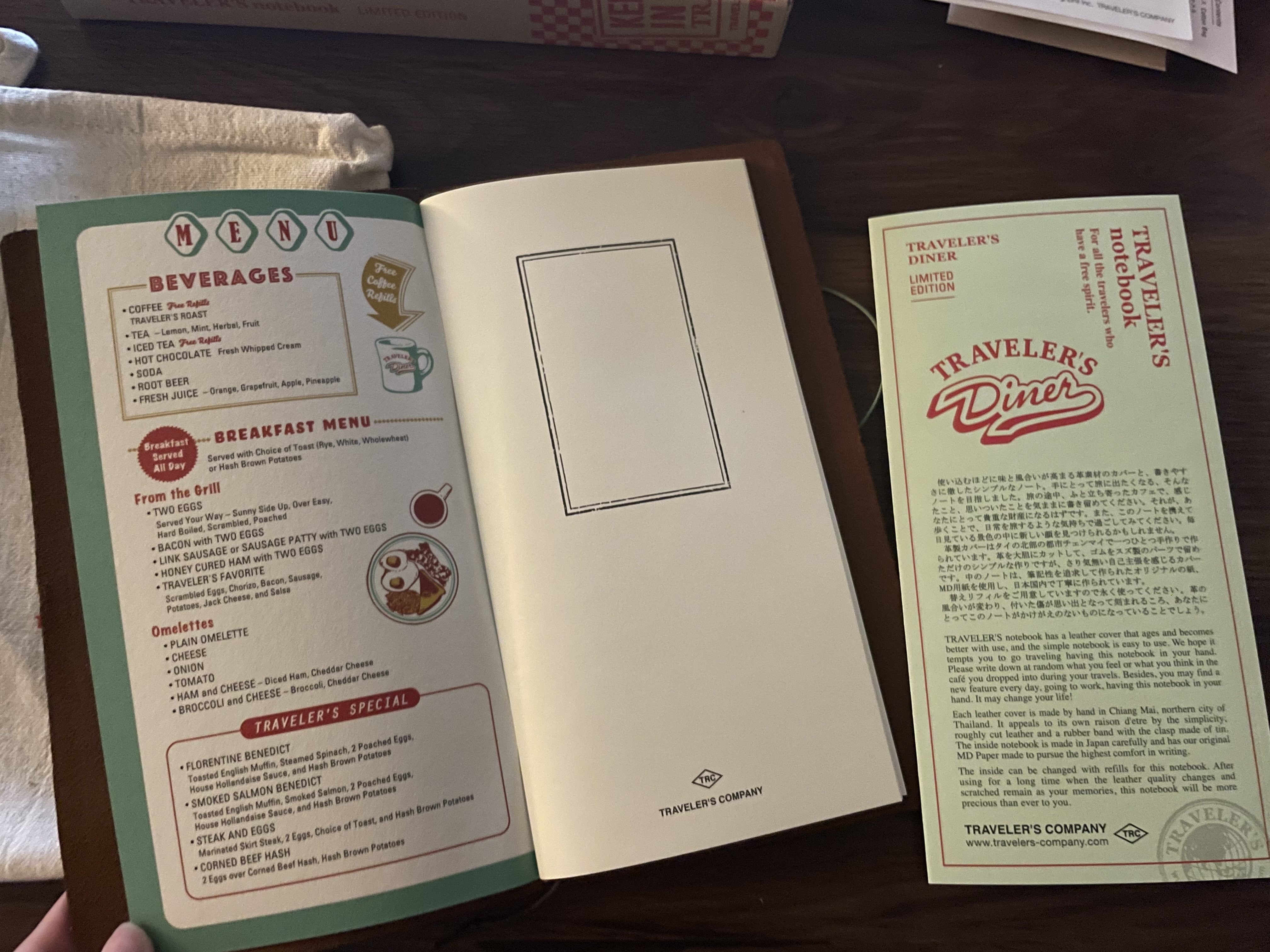 the left-side inner cover of the notebook, which shows an actual diner menu. this one shows various sections: beverages, the breakfast menu, and the specials